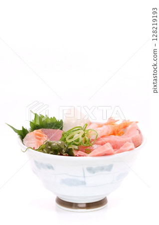 Seafood bowl, rice bowl with tuna, shrimp and salmon, light background Seafood bowl, rice bowl with tuna, shrimp and salmon, light background 128219193