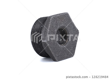 A close-up shot of a black, hex-shaped iron pipe fitting. 128219484
