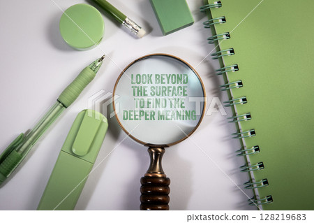 LOOK BEYOND THE SURFACE TO FIND THE DEEPER MEANING. Green Office Supplies on Desk LOOK BEYOND THE SURFACE TO FIND THE DEEPER MEANING. Green Office Supplies on Desk 128219683