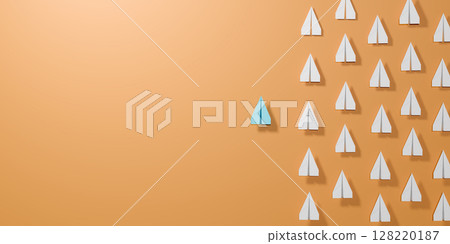 Blue paper airplane leads a group of white planes on orange background, symbolizing leadership, innovation, standing out, individuality, unique vision, breaking from conformity, business success. Blue paper airplane leads a group of white planes on orange background, symbolizing leadership, innovation, standing out, individuality, unique vision, breaking from conformity, business success. 128220187