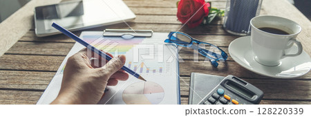 Banner Businesswoman reading financial graph charts business info with computer laptop. Panorama Women hands using laptop on office desk. Hands of business woman working office with copy space 128220339