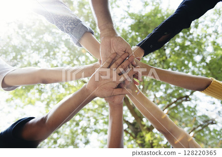 Diverse multiethnic Partners hands together teamwork group of multiracial people meeting join hands togetherness. Diversity people hands join empower partnership teams connection volunteer community Diverse multiethnic Partners hands together teamwork group of multiracial people meeting join hands togetherness. Diversity people hands join empower partnership teams connection volunteer community 128220365