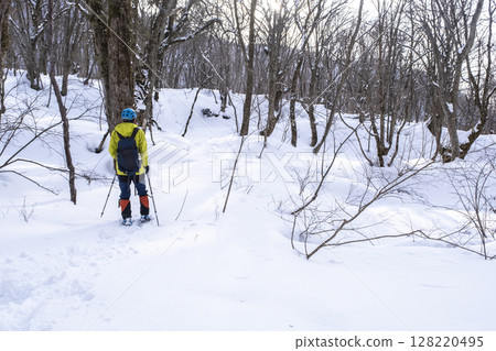 Image of enjoying fresh snow in the forest on snowshoes Oyamakiyazawa mountain stream Image of enjoying fresh snow in the forest on snowshoes Oyamakiyazawa mountain stream 128220495