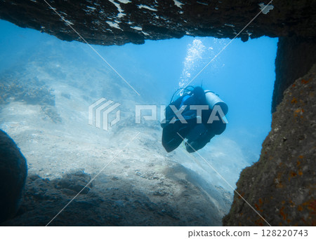 The driver swims out of an underwater cave at the bottom of the South China Sea in Vietnam 128220743