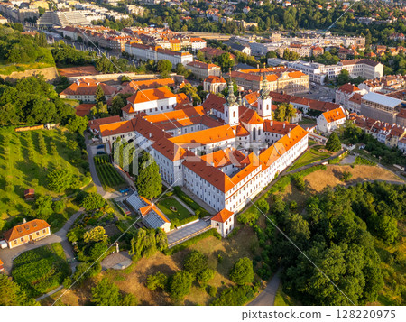 A breathtaking aerial view captures Strahov Monastery in Prague during sunrise. 128220975