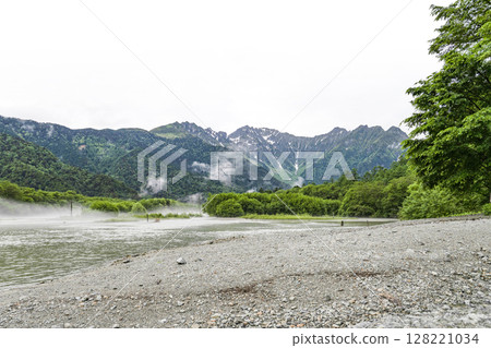 The Hotaka mountain range as seen from Taisho Pond after the rain 128221034
