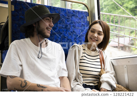 A woman enjoying a domestic trip on a cable car 128221422