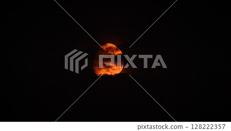 Full orange moon Moonrise in Dark Night cloudy Sky natural Background. nighttime Yellow Moon 128222357
