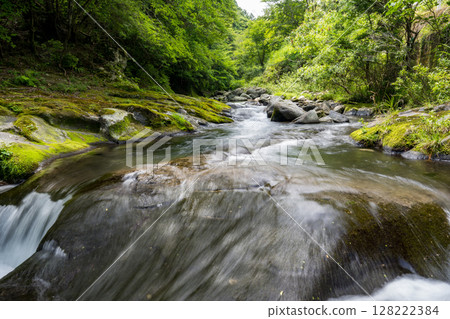 A clear waterfall flowing in summer 128222384