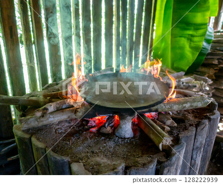 Cooking Cassava Cake in Siona Village, Cuyabeno, amazonia, Ecuador Cooking Cassava Cake in Siona Village, Cuyabeno, amazonia, Ecuador 128222939