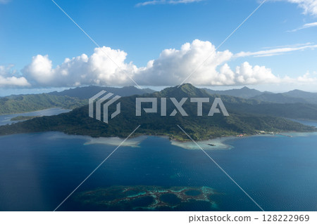 Aerial view of Tahaa island, French Polynesia, with turquoise lagoon and reef Aerial view of Tahaa island, French Polynesia, with turquoise lagoon and reef 128222969