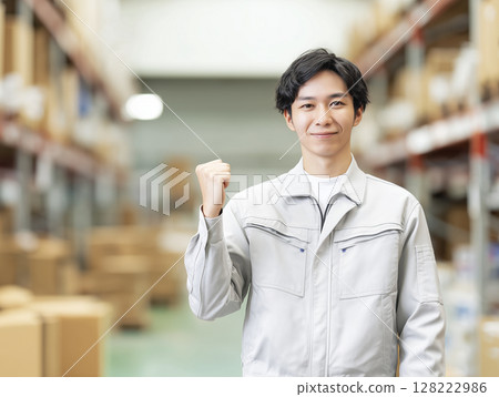 AI-generated image: A young, smiling man doing a fist pump at a distribution center 128222986