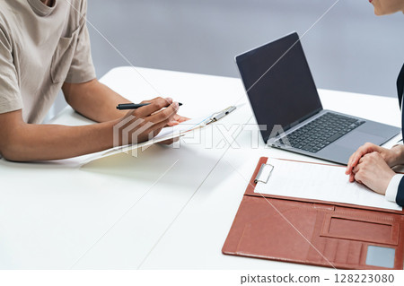 A black man and a Japanese female staff member having an interview A black man and a Japanese female staff member having an interview 128223080
