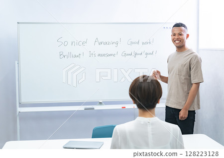 A black male teacher giving an English lesson 128223128