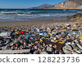Plastic waste polluting a beautiful pebble beach and the sea in Karpathos, Greece 128223736