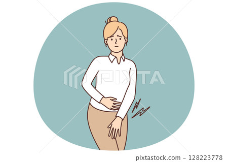 Unhappy girl painfully presses palm to perineum during menstruation or bladder problems Unhappy girl painfully presses palm to perineum during menstruation or bladder problems 128223778