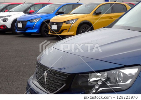 Imported car image: Imported cars lined up at a dealership 128223970