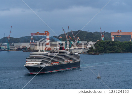 Cruise ship arriving at Nagasaki Port (Queen Elizabeth) from Megami Ohashi Bridge [Nagasaki City] 128224163