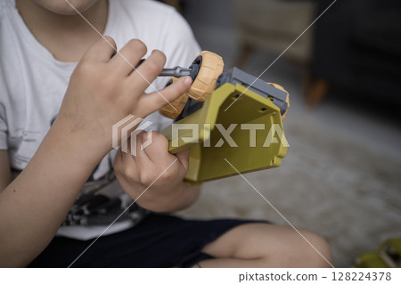 Child with autism playing with cars. Autism concept 128224378