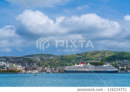 Cruise ship arriving at Nagasaki Port (Queen Elizabeth) from the opposite shore [Nagasaki City] 128224751