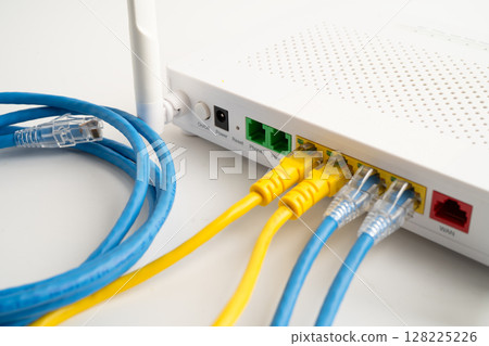 Ethernet cable with wireless router connect to internet service provider internet network. Ethernet cable with wireless router connect to internet service provider internet network. 128225226