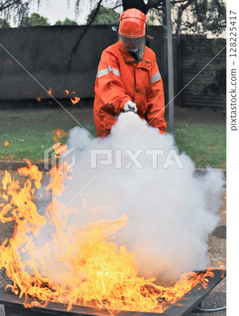 corporate safety - exercise during a firefighting course 128225417