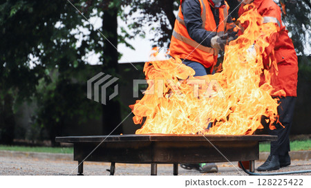 corporate safety - exercise during a firefighting course 128225422