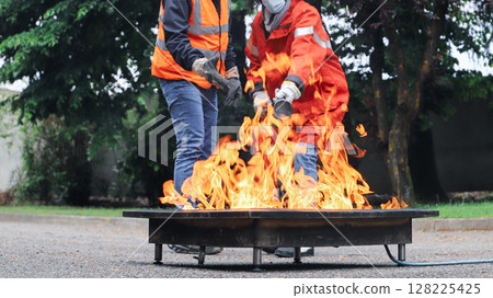 corporate safety - exercise during a firefighting course corporate safety - exercise during a firefighting course 128225425