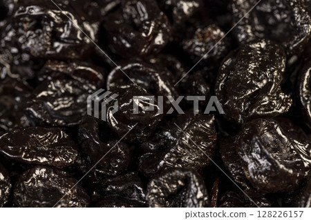a large amount of prunes used in cooking, black prunes from small plums are dehydrated and pitted 128226157