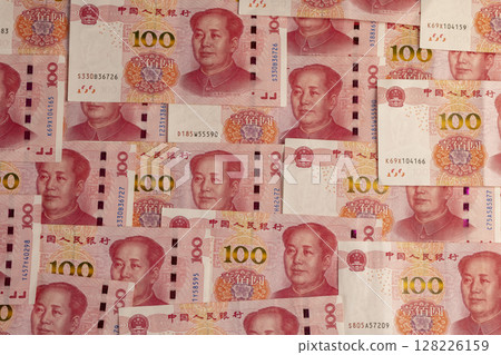 Chinese paper money of one hundred yuan , the obverse of a large number of genuine Chinese yuan money stacked on top of each other 128226159
