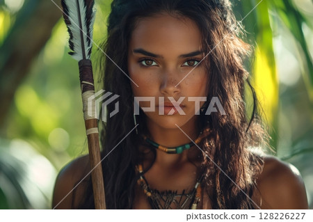 Indigenous amazonian hunter woman holding spear in tropical rainforest 128226227