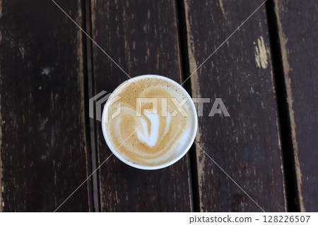 There is hot black coffee in a glass 128226507