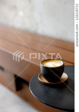 Cup of milk latte coffee on table by the street. 128226722