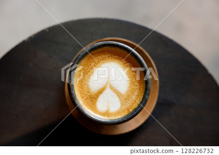 Cup of milk latte coffee on table by the street. 128226732