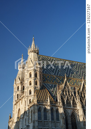 St. Stephen's Cathedral in Vienna against a blue sky. St. Stephen's Cathedral in Vienna against a blue sky. 128227167