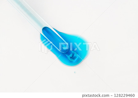 Drop of cosmetics and a pipette on a white background. 128229460