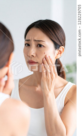 A woman concerned about facial blemishes (AI-generated image) 128229705