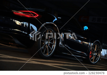 Shiny black sports car 128230478