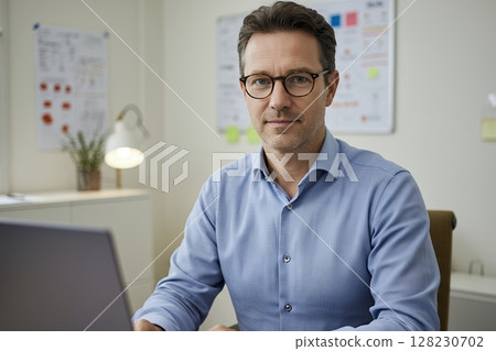 A serious looking businessman A serious looking businessman 128230702