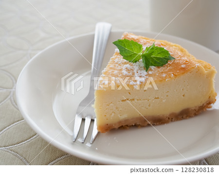 Homemade baked cheesecake cut into slices 128230818
