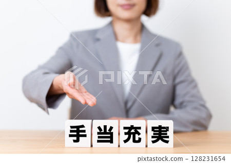 A middle-aged female business woman wearing a suit and a block with ample benefits A middle-aged female business woman wearing a suit and a block with ample benefits 128231654
