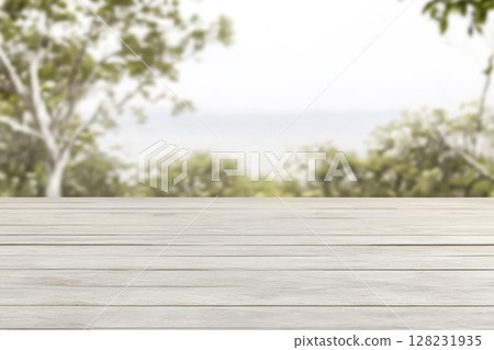 Wooden surface with blurred greenery in the background during daylight 128231935