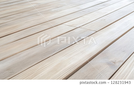 Natural wooden floor with smooth planks and light finish in a cozy interior setting 128231943