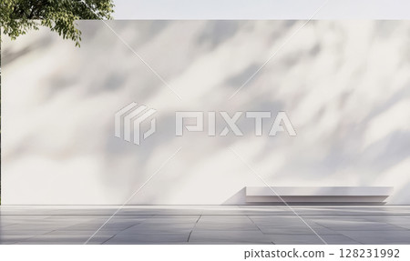 Modern outdoor area featuring a minimalistic white wall and sleek platform under soft sunlight 128231992