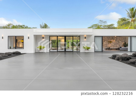 Modern architectural design of a tranquil home surrounded by tropical greenery 128232216