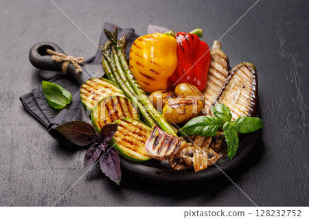Assorted grilled vegetables including bell peppers, zucchini, eggplant, and asparagus 128232752