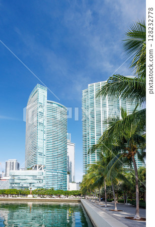 Modern skyline of Miami with towering skyscrapers, tropical vibe, and waterfront views Modern skyline of Miami with towering skyscrapers, tropical vibe, and waterfront views 128232778