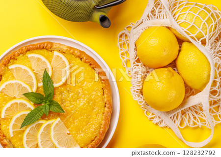 Delicious lemon tart with golden crust and smooth, glossy lemon filling 128232792