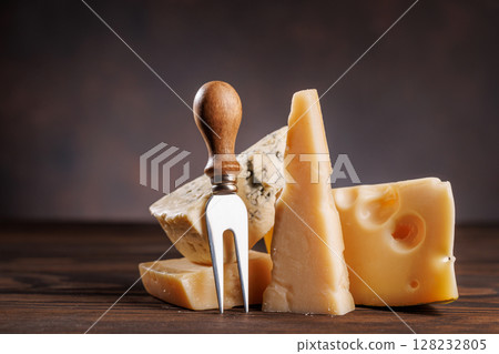 Assorted cheeses in different shapes and textures displayed together 128232805