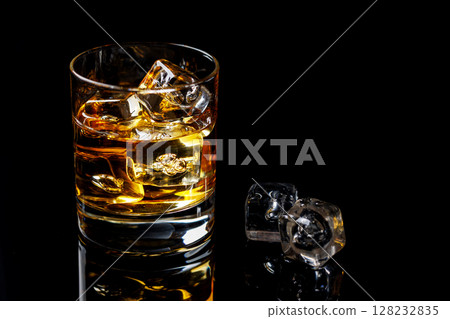 A refined glass of whiskey on the rocks 128232835